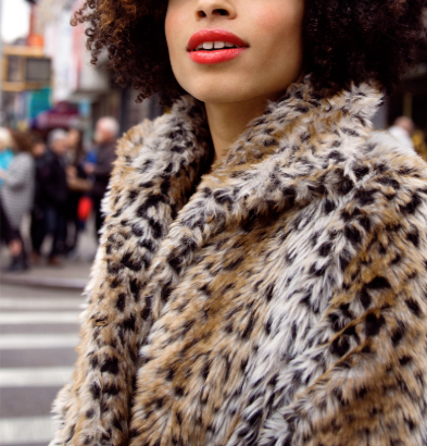 Woman wearing red lipstick and a leopard print coat